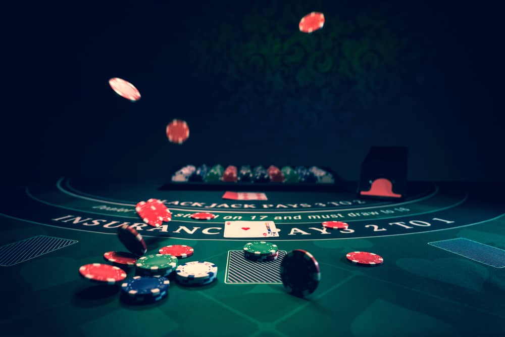 blackjack table with poker chips and cards casino party rentals vegas concepts